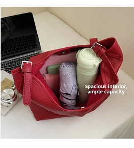 Interior view of large capacity red lychee leather tote bag showing spacious storage