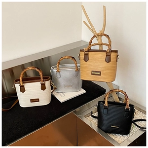 Bamboo handle bucket bags in four colors with woven texture and detachable straps
