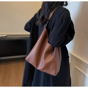Brown litchi grain tote bag shown from behind, highlighting its hobo style and large capacity