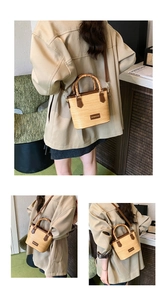 Detail of woven straw bucket bag featuring retro bamboo handle and brown leather trim