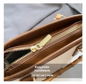 Macro shot of gold metal zipper and bamboo handle detail on woven bucket bag