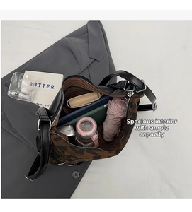 Detailed interior of leopard print crossbody bag showing spacious capacity for daily items
