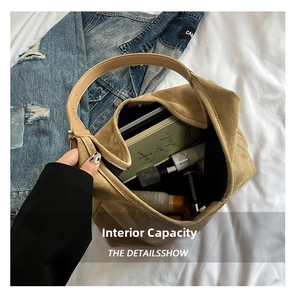 Macro shot showing the spacious interior of this brown suede tote bag with daily essentials