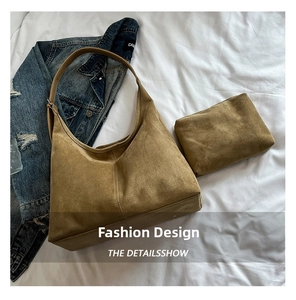 Macro detail of tan suede hobo bag set featuring a matching pouch and soft texture