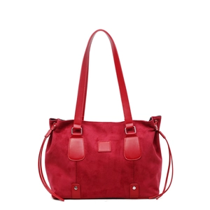 Minimalist red suede tote bag with leather straps and drawstring details for summer fashion