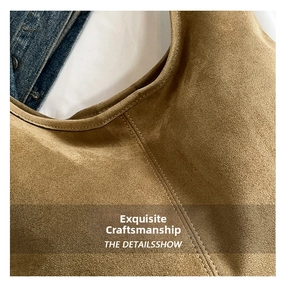 Detail showing high-quality double stitching and soft suede texture on brown tote bag