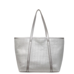 Silver woven tote bag with a spacious interior and metallic finish for chic women
