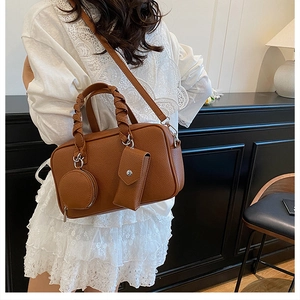 Brown Boston bag with woven handles, detachable shoulder strap and mini coin pouches