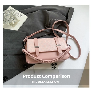 Pink crossbody bag with plaid embossed flap and thick braided handle on grey suit background