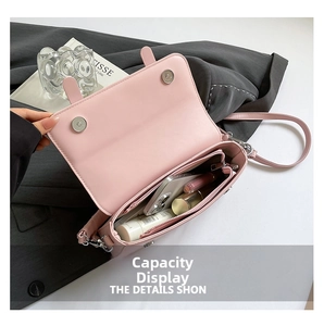 Pink leather flap shoulder bag showing spacious interior with phone and cosmetics