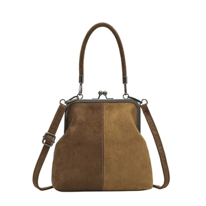 Retro two-tone brown suede shell bag with metal clasp and adjustable shoulder strap