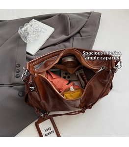 Interior view of brown leather bag showing spacious compartments and storage capacity