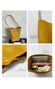 Detail view of yellow faux suede bucket bag featuring side bow and large interior space