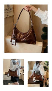 Close-up of brown vintage leather underarm bag with knot details and Lazy Breeze tag