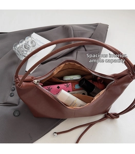 Spacious interior of caramel brown faux leather hobo bag showing high storage capacity