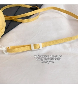 Adjustable bright yellow nylon shoulder strap with durable white plastic buckles and hooks