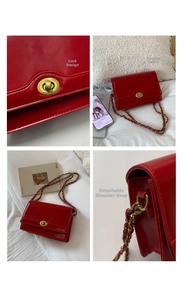 Detail of red patent leather shoulder bag showing metal clasp and woven chain strap