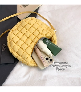 Detailed interior view of a yellow quilted crossbody bag with daily makeup essentials