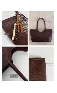 Detail view of dark brown woven tote bag handle and bohemian beaded pendant charm