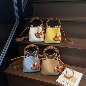 Retro canvas bucket bag with leather handles and rocking horse charm in four colors