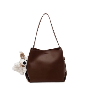 Minimalist deep coffee hobo bucket bag with a cute plush polar bear pendant charm