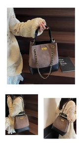 Detailed close-up of quilted suede tote with gold clasp and leather-threaded chain