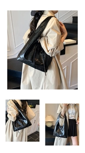 Detail of black glossy tote bag with drawstring texture and large capacity for daily use