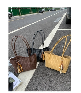 Three woven tote bags in brown black and yellow with retro wooden bead charms
