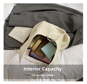 Interior view showing the large storage capacity of the cream leather bucket bag