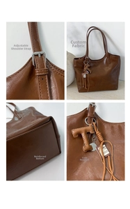 Macro details of brown tote bag with adjustable strap and textured leather finish