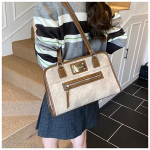 Detail of elegant bow lace tote bag with marble PU leather and gold zipper pocket