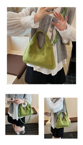Detail of green faux suede hobo bag with unique knotted strap and minimalist curved design