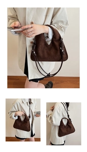 Detail of dark brown suede tote bag featuring unique knotted shoulder strap design