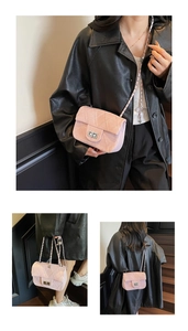 Detailed view of pink tweed shoulder bag with silver quilted stitching and metal chain strap