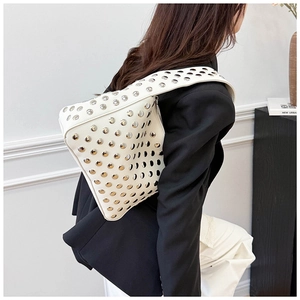 Close-up of white punk-style shoulder bag with silver metal studs and high-quality PU leather