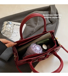 Internal view of red wedding handbag showing spacious three-layer structure for essentials