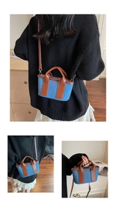 Vista a tre angoli di una borsa Boston in denim che mostra lo stile a tracolla e a mano