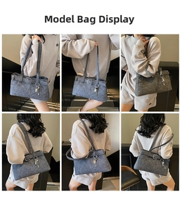 Detailed views of grey denim shoulder bag with metal key charm and buckle straps