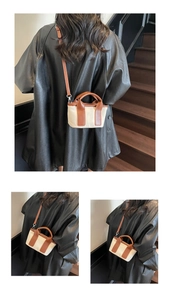 Dettaglio delle cuciture in tela e pelle marrone sulla borsa a tracolla vintage