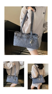 Detail of blue denim texture bag with metal buckles, key and padlock charms