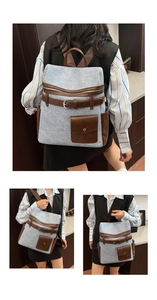 Detail view of light blue textured fabric backpack with brown leather strap accents