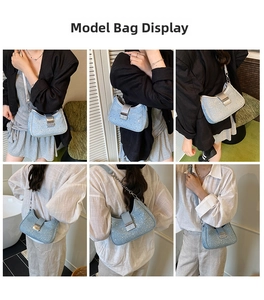 Detail of light blue crescent bag with shiny rhinestones and silver metal buckle closure