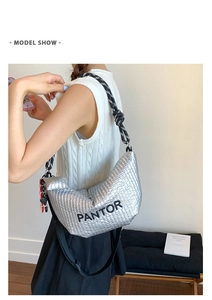 Silver quilted hobo bag detail with black PANTOR logo and bicolor rope strap