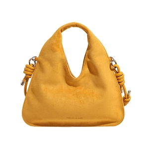 Detail of ginger suede dumpling bag featuring wave opening and knot metal ring accents