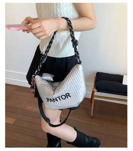 Detail of silver quilted hobo bag with PANTOR embroidery and rope shoulder strap