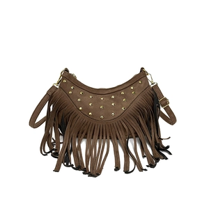 Brown suede crescent bag featuring retro rivets and long tassels with a shoulder strap
