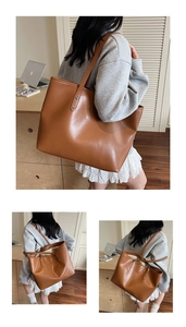 Detail view of large brown faux leather tote bag with silver rivets for daily commuting