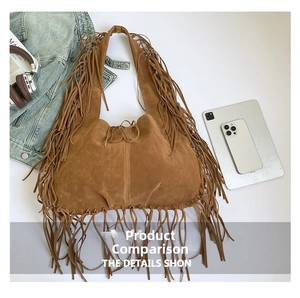Close-up of brown suede tote bag featuring bohemian fringes and tie closure detail
