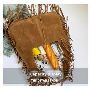 Interior storage capacity view of vintage brown fringe shoulder bag with bohemian tassels