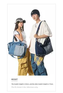 Macro shot of patchwork denim tote bag with frayed edges and dual-tone blue vintage style
